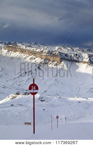 Ski Slope At Evening And Storm Sky