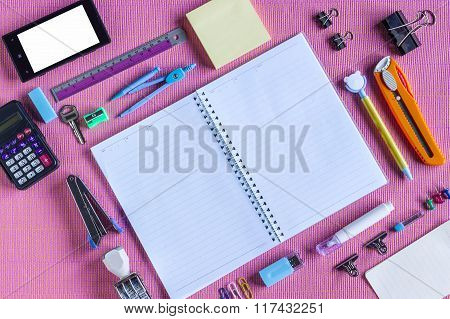 Type Around Note Book Open to Blank Page Arranged on pink fabric