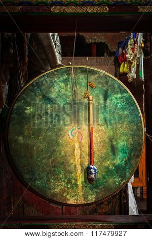Large tibetan drum with beater in Hemis gompa (Tibetan Buddhist monastery). Ladakh, India