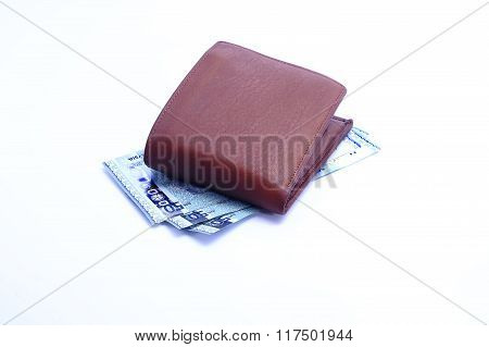 Brown leather wallet with Malaysian Ringgit in white background