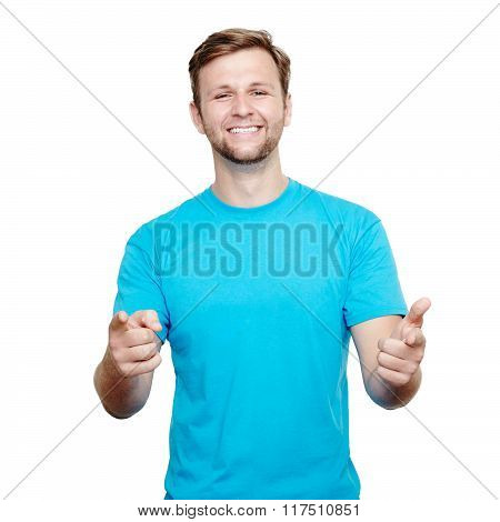 Smiling young man pointing at camera