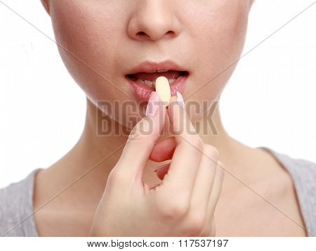 Close Up Hand With A Pill And The Mouth