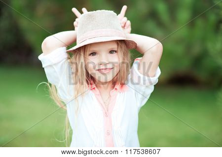 Smiling kid girl outdoors