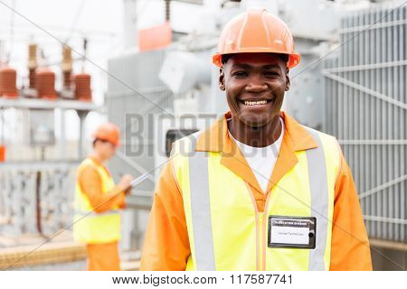 happy senior african american technical worker in substation