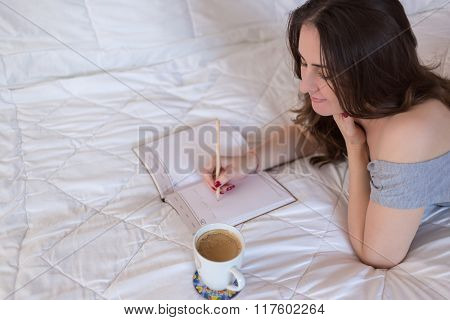Woman writing in her notebook