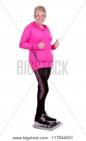Fit Woman Stepping On Scale