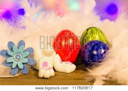A white Easter bunny searching in a white Easternest