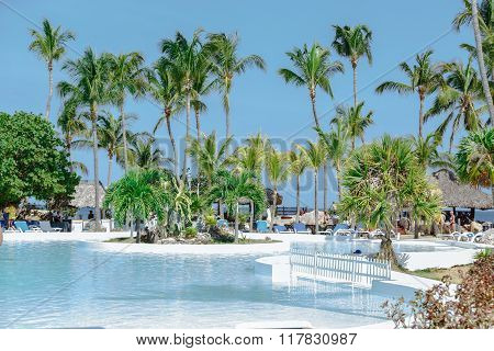 gorgeous splendid inviting view of beautiful swimming pool in tropical garden near the beach and oc