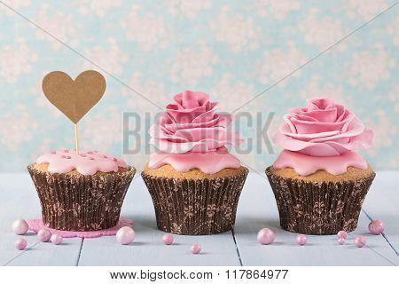 Cupcakes with heart cakepick for text