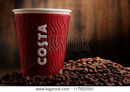 Composition With Cup Of Costa Coffee Coffee And Beans