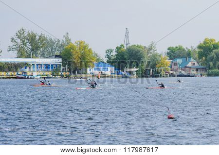 Kherson, Ukraine, September 30, 2014 competition of rowing. Sportsmen in sport kayaks paddles on the water. More than 100 participants took part in the competitions. Swimming boating.