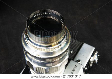 DONETSK, UKRAINE - May 07, 2016: old soviet film SLR camera Zenit - B with lens Jupiter-11, for use with 35 mm film, made in USSR in 1968 - 1973, manufactured by KMZ, with original leather case