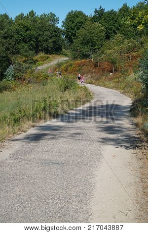 ARCADE, SPAIN - SEPTEMBER 8, 2017: Pilgrims on the Pilgrim trail between Redondela and Pontevedra close to Arcade, Camino de Santiago trail on September 8, 2017 in Spain