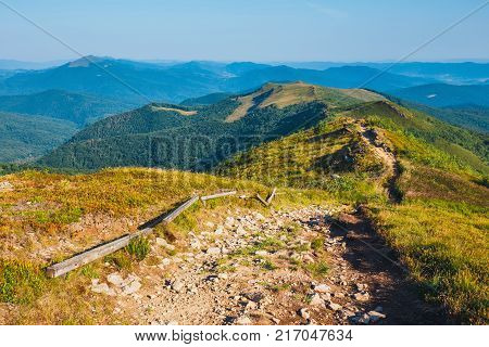 Summer Mountain Landscape At Sunrise With Grass And Blue Sky