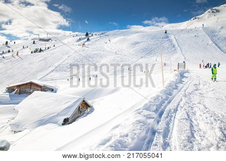 MARCH 2017 - ZILLERTAL, AUSTRIA: People skiing on prepared slopes covered by fresh snow in Austrian Alps Zillertal Austria Europe.