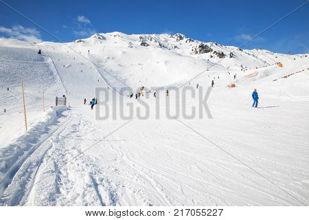 HOCHFUGEN AUSTRIA - March 2017 - People skiing on prepared slopes covered by fresh snow in Austrian Alps Zillertal Austria Europe.