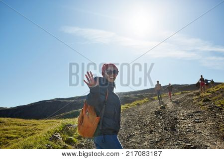 woman traveler on a walk in the Valley of the river of Hveragerdi Iceland. Hiking Tour of Reykjadalur Hot Springs