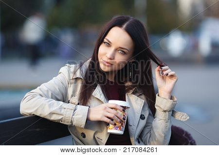 Beautiful young girl with cup of coffee