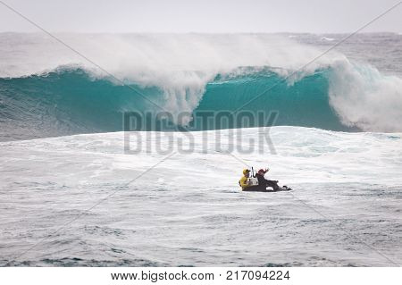 SUNSET BEACH HAWAII USA - DECEMBER 2: Surf patrol filming the break at the 2017 Vans World Cup of Surfing competition at Sunset Beach on Oahu's scenic North Shore. This is the second of three surfing competitions and Conner Coffin