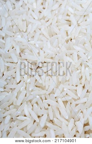 Rice background. Rice texture basmati long pattern, white raw uncooked rice closeup Rices.