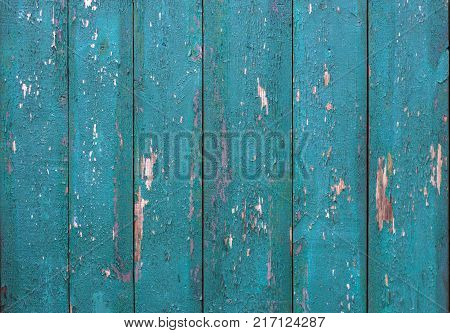 Abstract background of old worn wooden boards of different colors close up
