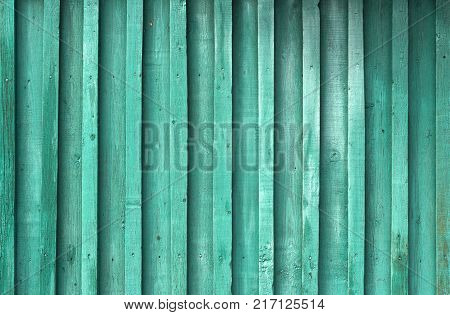 Abstract background of old worn wooden boards of different colors close up
