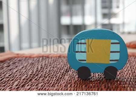 Traditional thai style nature background of brown handicraft weave texture wicker surface for furniture material with blue toy car on it