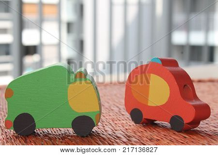 Traditional thai style nature background of brown handicraft weave texture wicker surface for furniture material with red and green toy cars on it