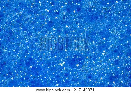 Deep blue bubbles. Macro pattern and texture backgound image of bubbly soapsuds froth.