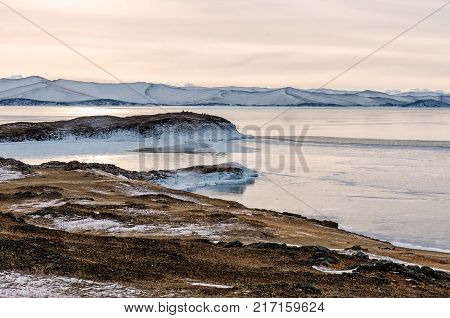 View above big beautiful lake and mountain in winter, Baikal lake, Russia, Siberia