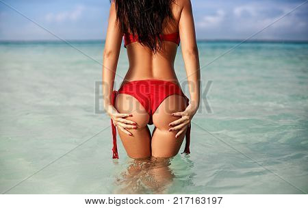 Perfect ass of a young girl in a tropical island