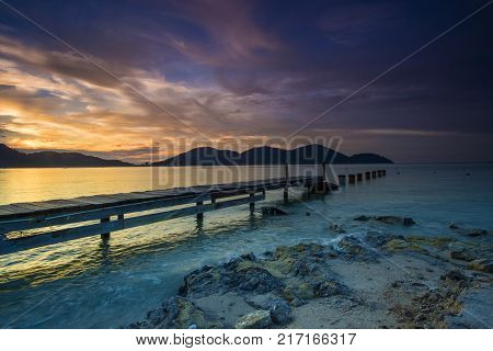 Beautiful view of sunset at Lumut,Perak,Malaysia. Soft focus,motion blur due to Long Exposure.Visible noise due to High ISO.