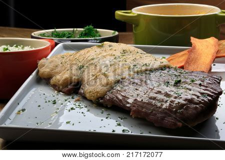 Roasted meat with rice, farofa and kale