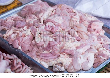 raw animal pork chitterlings. Fresh chitterlings at market