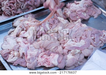 raw animal pork chitterlings. Fresh chitterlings at market