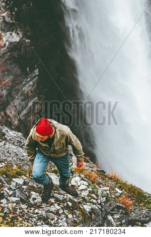 Man hiking waterfall mountains outdoor Travel Lifestyle survival concept adventure vacations wild nature landscape