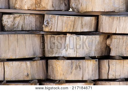 Wood Background Texture. Cross Section Of Tree Trunk. Spili Trees Stumps Stacked In Stacks. Used For