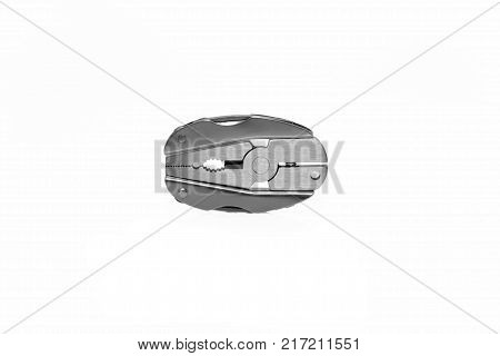 Multitool of steel isolated on white background.