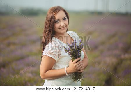 Beautifull Brunette Buxom Nubile Lady Woman With Deep Blue Eyes Posing On Field Of Spring Lavender W