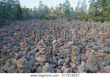 Area in the forest covered with many mysterious piles of stones in the village Geta on the island Aaland part of Finland in northern Europe