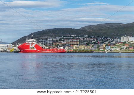 Panorama of Hammerfest and large red ship on the coast of Norwegian Sea