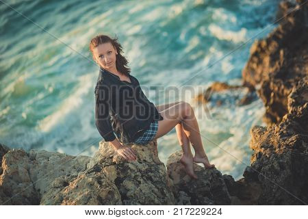 Hot Sexy Stylish Dressed Young Lady Brunette Hairs And Pinky Cheeks With Open Legs Shoulders And Arm