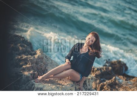 Hot Sexy Stylish Dressed Young Lady Brunette Hairs And Pinky Cheeks With Open Legs Shoulders And Arm
