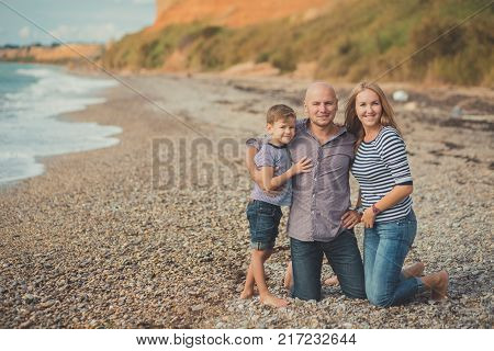 Lovely Amazing Scene Of Happy Family Of Handsome Father Beautiful Lady Mother And Cute Little Son Bo