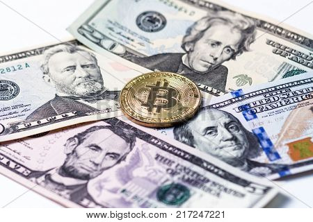 The symbol of the crypto currency is a gold bitcoin and different denominations of US dollars.
