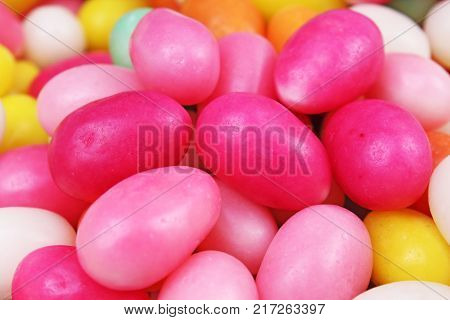 Easter candy. Egg shaped sugar candy for easter season. Egg shaped candy. Pink yellow.