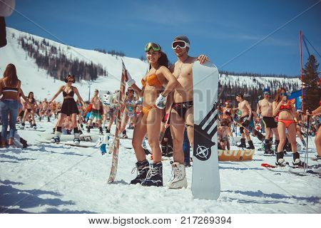Sheregesh, Kemerovo region, Russia - April 16, 2016: Grelka Fest is a sports and entertainment activity for ski and snowboard riders in bikini.girl bikini swimsuit on a snowboard