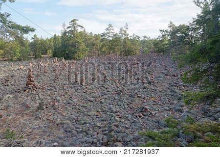 Area in the forest covered with many mysterious piles of stones in the village Geta on the island Aaland part of Finland in northern Europe