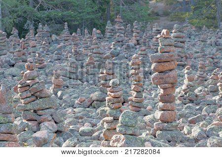 Area in the forest covered with many mysterious piles of stones in the village Geta on the island Aaland part of Finland in northern Europe