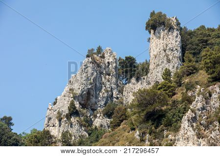 View from the boat on the cliff coast of Capri Island Italy